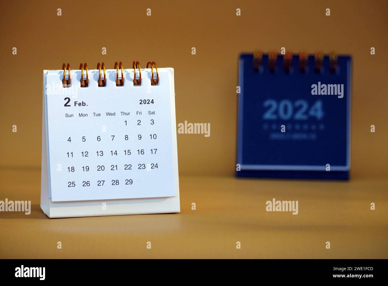 Desk calendar for February 2024 on a gold background copy space Stock ...