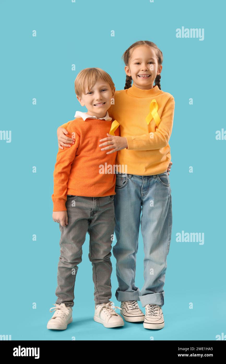 Cute little children with yellow ribbons on blue background. Childhood ...