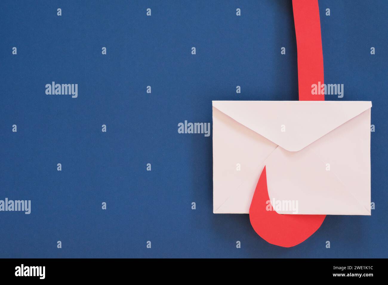Letter envelope on a hook. Clickbait email scam and message. Stock Photo