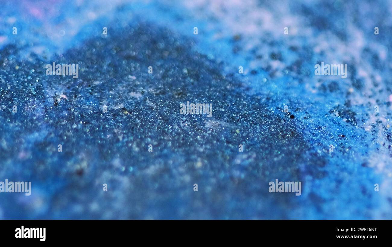 Glitter fluid spill paint drip blue black ink mix Stock Photo Alamy