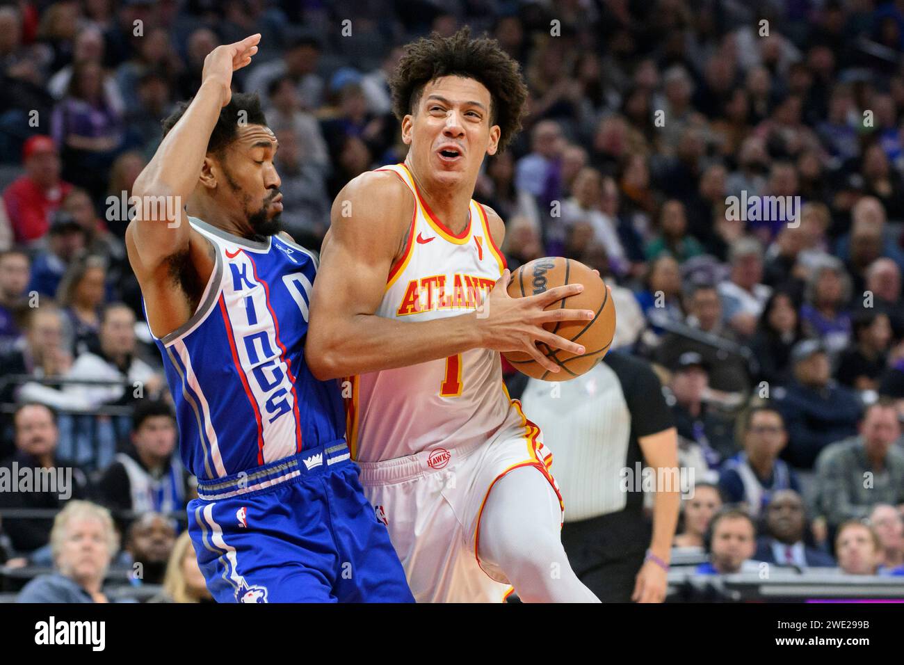 Atlanta Hawks forward Jalen Johnson, right, drives past Sacramento