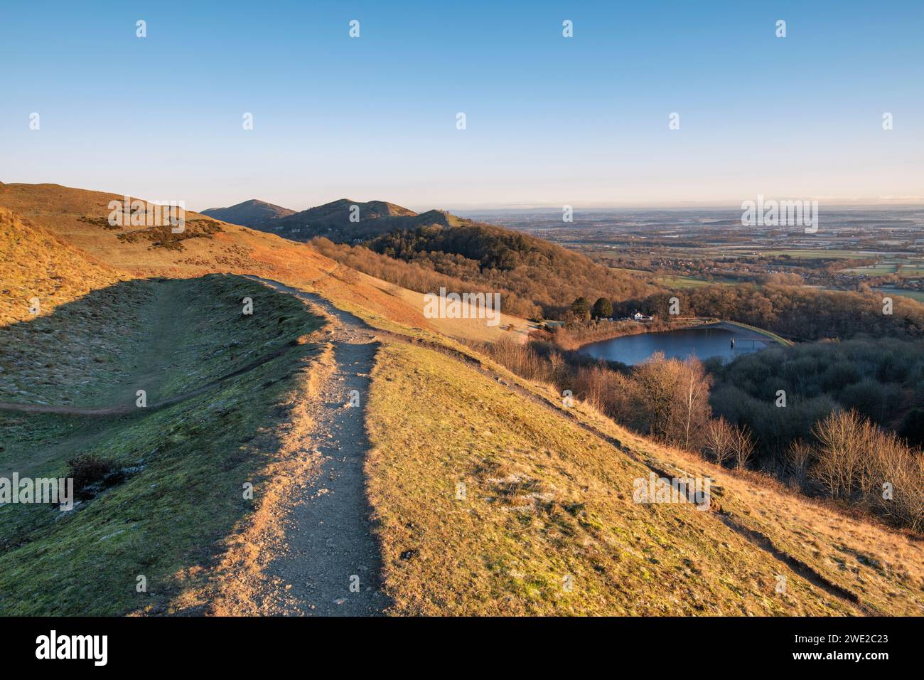 Winter sunrise light over the British Camp Reservoir and the Malvern hills, Worcestershire, England Stock Photo