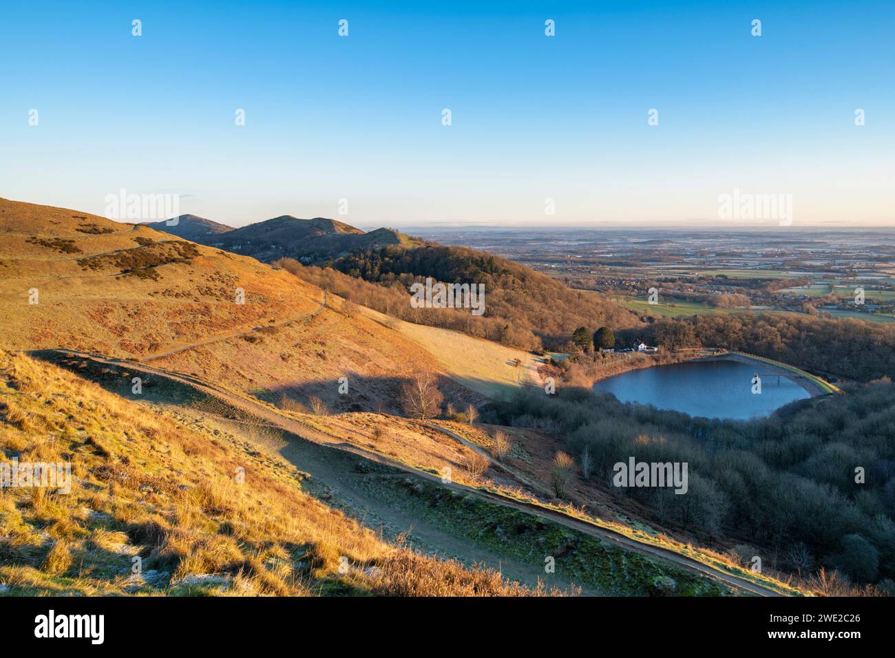 Winter sunrise light over the British Camp Reservoir and the Malvern hills, Worcestershire, England Stock Photo