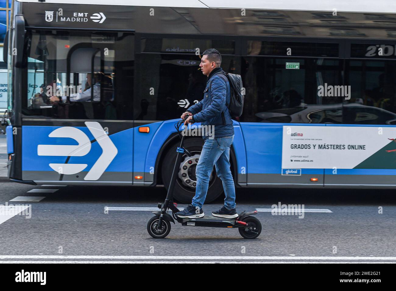 Madrid, Spain. 22nd Jan, 2024. A man rides an electric scooter in the