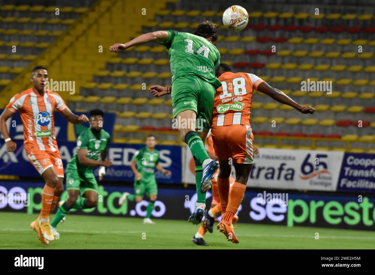 Bogota, Colombia. 22nd Jan, 2024. Equidad's Felipe Acosta wins a fight for a headshot against Envigado's William Hurtado during the Equidad vs Envigado match for the Betplay Dimayor league in the Techo stadium in Bogota, Colombia, January 22, 2024. Photo by: Cristian Bayona/Long Visual Press Credit: Long Visual Press/Alamy Live News Stock Photo