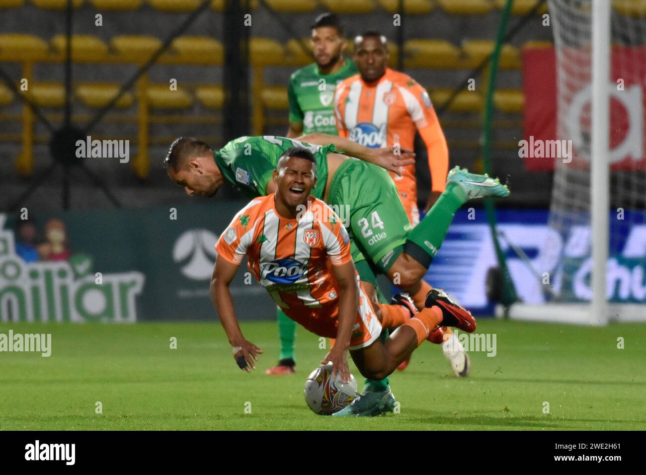 Bogota, Colombia. 22nd Jan, 2024. Envigado's Rubio Cesar Espana falls after fighting for a ball against Equidad's Juan Alejandro Maecha during the Equidad vs Envigado match for the Betplay Dimayor league in the Techo stadium in Bogota, Colombia, January 22, 2024. Photo by: Cristian Bayona/Long Visual Press Credit: Long Visual Press/Alamy Live News Stock Photo