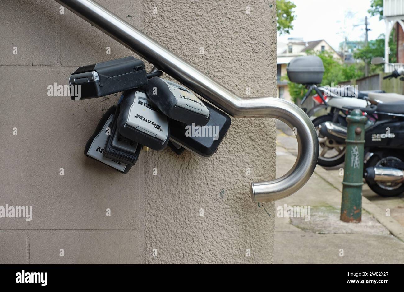 Housing in inner Sydney, a cluster of key safe boxes hang from an ...