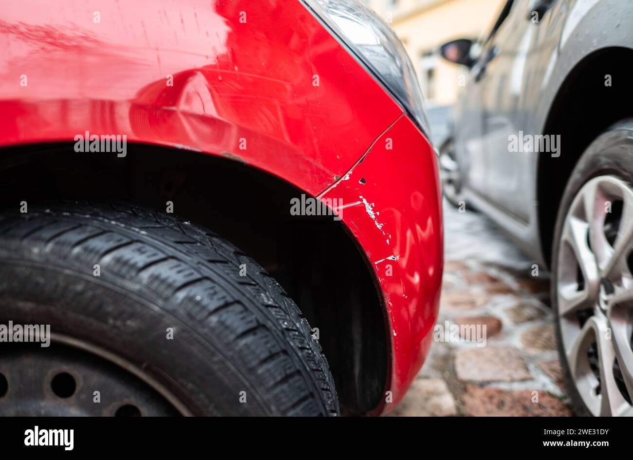 Dresden, Germany. 22nd Jan, 2024. A red car with a fender bender is