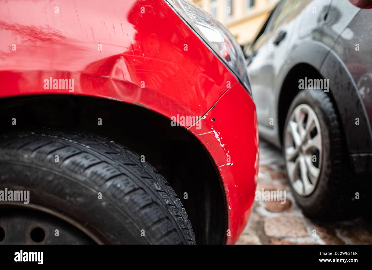 Dresden, Germany. 22nd Jan, 2024. A red car with a fender bender is
