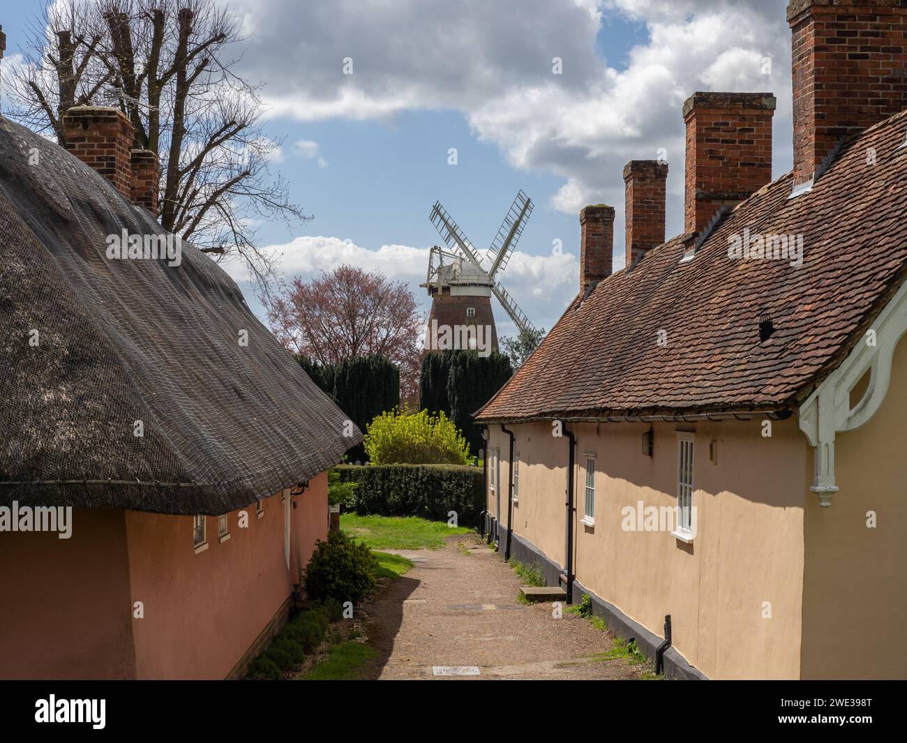 John Webb's Windmill,from 1804, framed by historic almshouses, Thaxted, Essex, UK Stock Photo