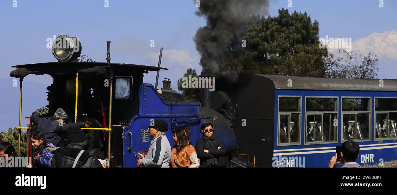 Darjeeling, West Bengal, India - 15th February 2022: Toy train ride, UNESCO world heritage Darjeeling Himalayan Railway at Batasia Loop Stock Photo