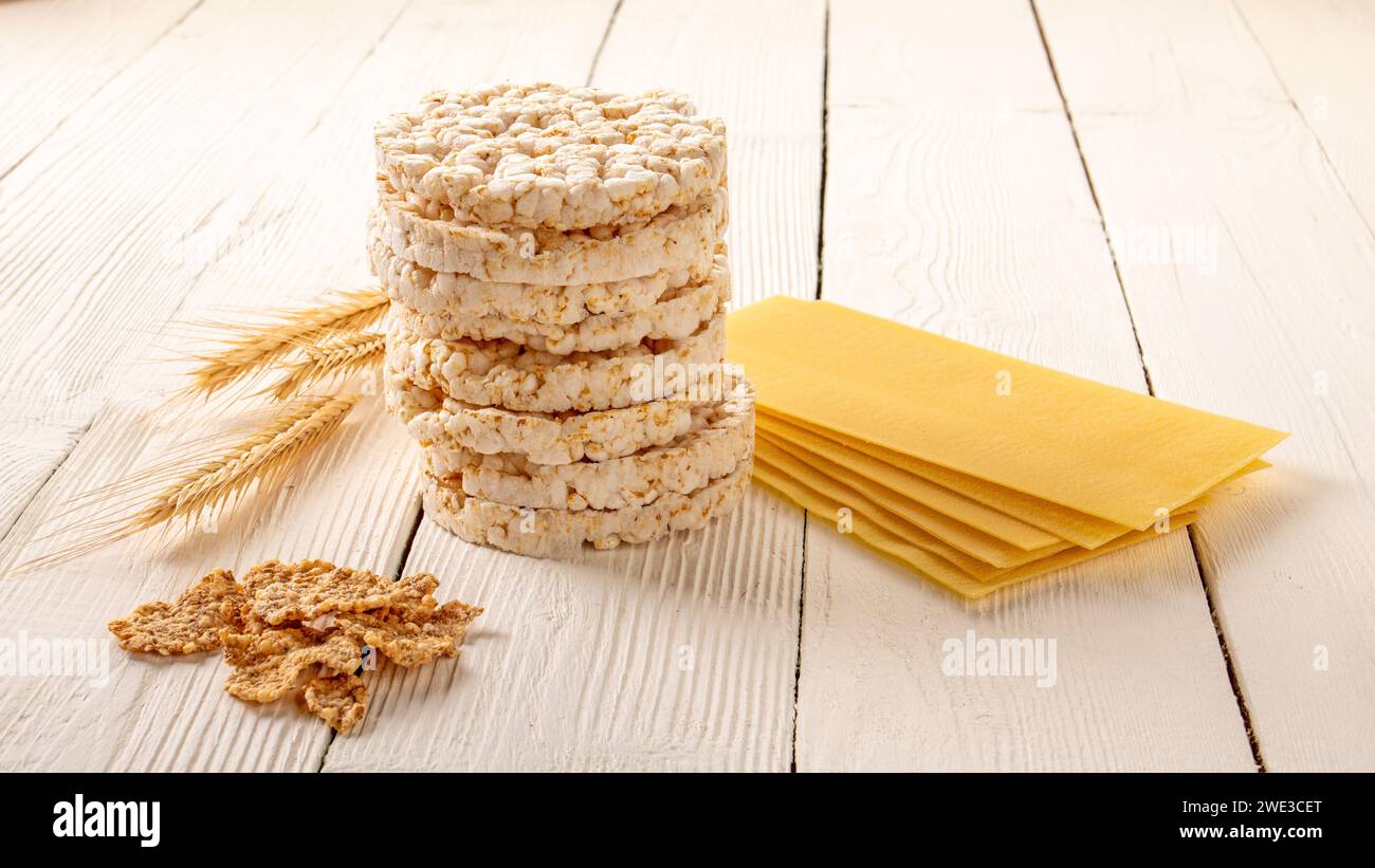 A tasteful and nutritious breakfast presentation of rice cakes arranged on a clean white wooden table, promising a delightful and nourishing start to Stock Photo