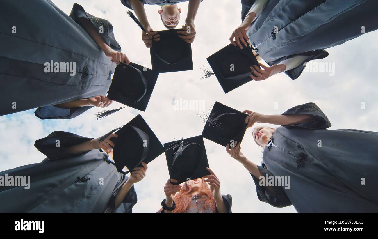 Graduates in robes caps hi-res stock photography and images - Alamy