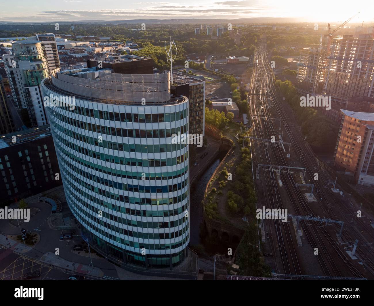 Aerial photograph of Victoria Place and railway tracks from Manchester Victoria train station leading off into the distance at a beautiful sunrise Stock Photo