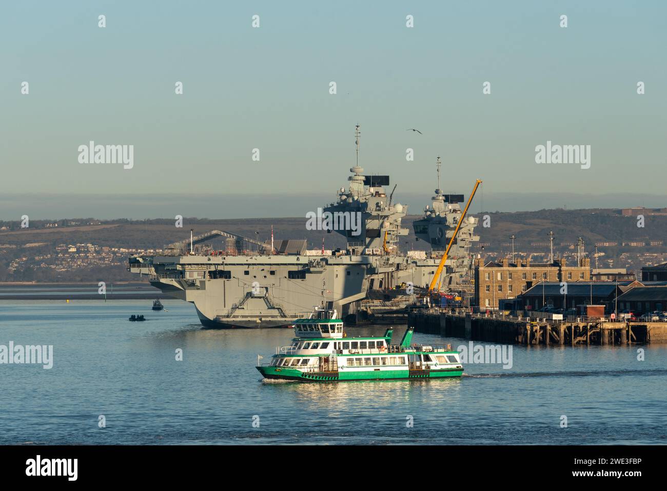 Gosport ferry crossing Portsmouth harbour in front of the Navy's