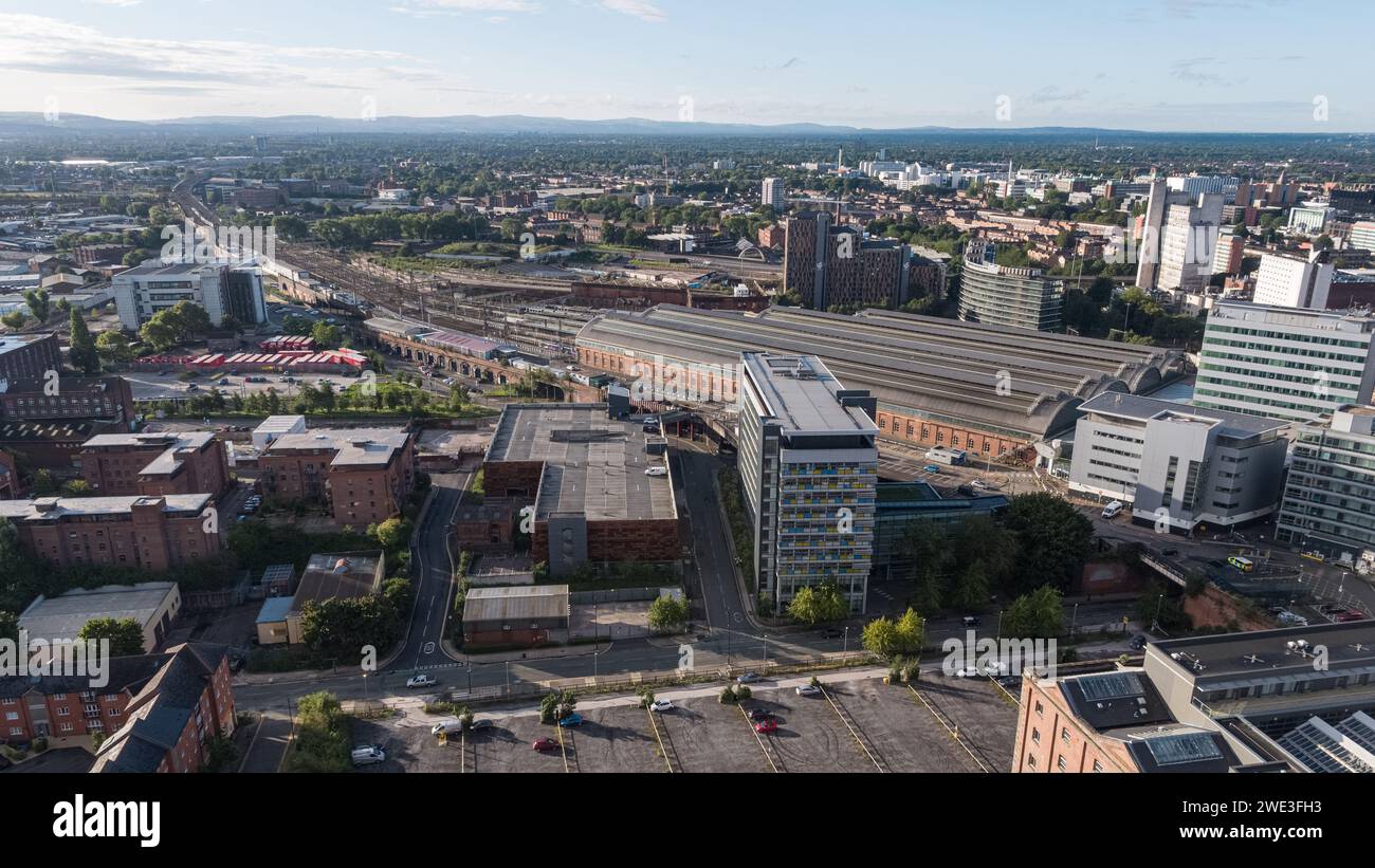 Panoramic aerial photograph of Piccadilly Hotel, Piccadilly train station and train tracks leading into the distance with Manchester city centre, UK Stock Photo