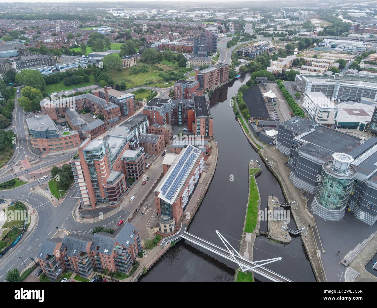 Aerial photograph away from Leeds city centre looking to Knights Way Bridge, Leeds Dock, Royal Armouries, River Aire, East Street, Yorkshire, UK Stock Photo