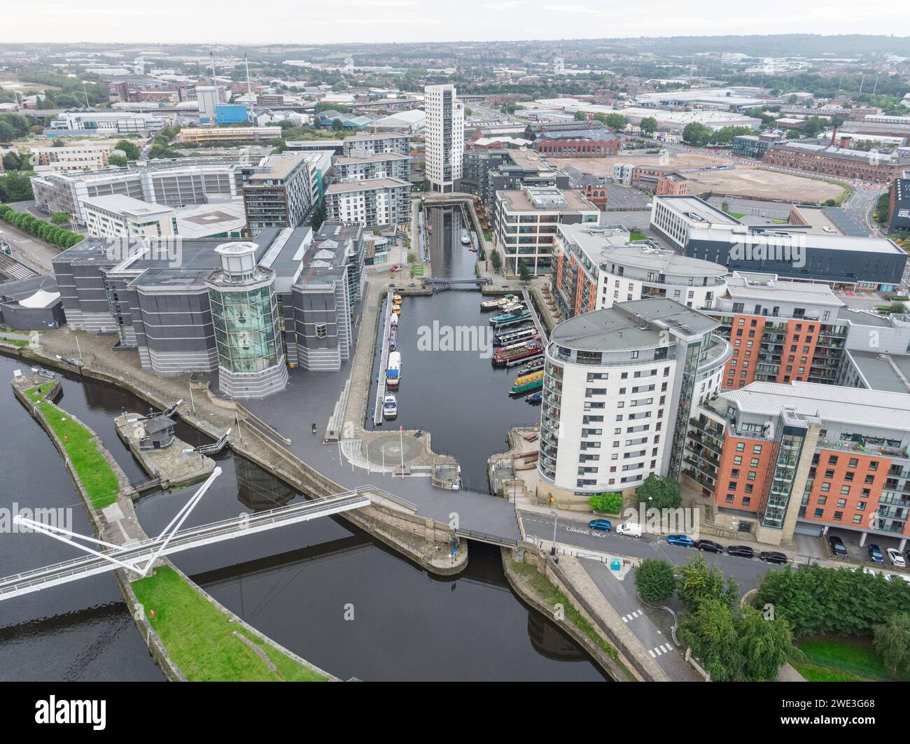 Aerial photograph looking over the River Aire, Brewery House, Clarence House, Royal Armouries and Leeds Dock from Leeds city centre, Yorkshire, UK Stock Photo