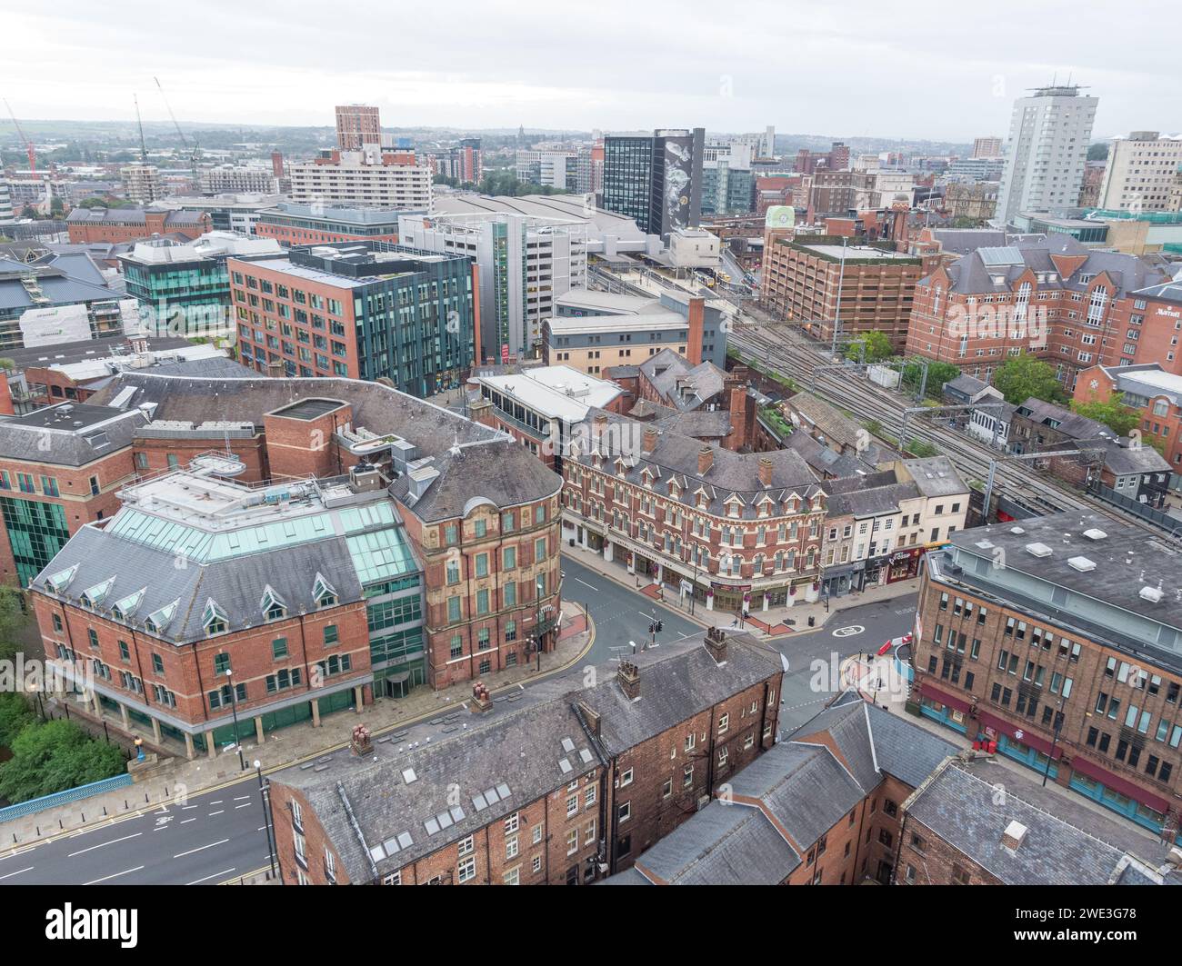 Aerial photograph of Leeds Station train station, platforms and train tracks including the Leeds city centre, Yorkshire, UK Stock Photo
