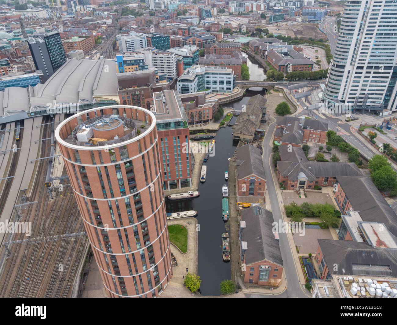 Aerial photograph of Candle House in the foreground with Granary Wharf, Leeds train station, Leeds Liverpool Canal & Leeds city centre, Yorkshire, UK Stock Photo