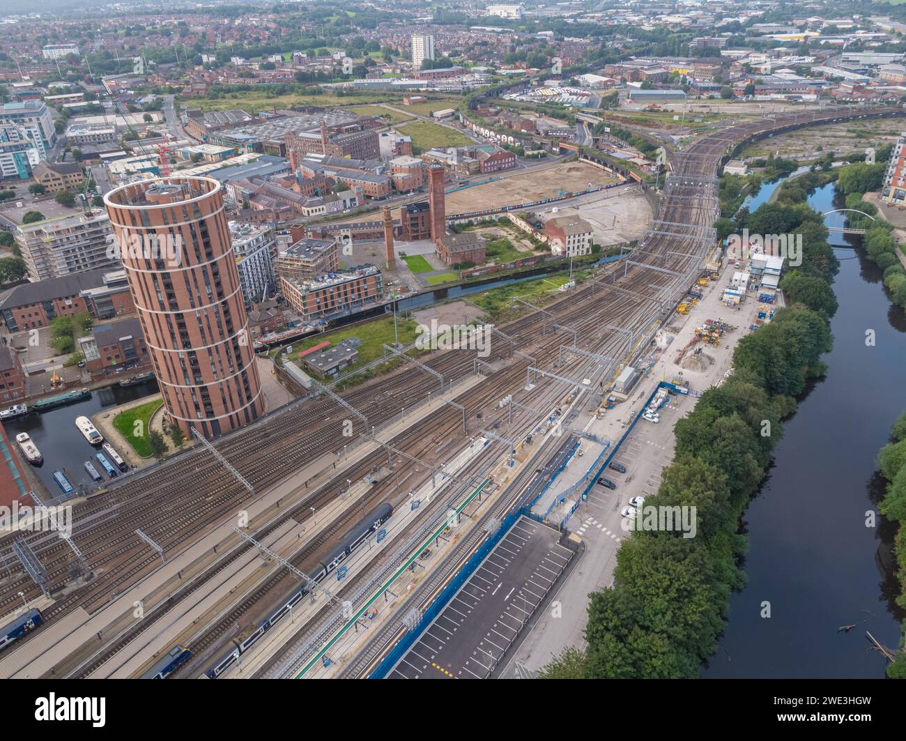 Aerial image of the platforms and railway lines away from Leeds Station with the River Aire, Temple & Candle House in Leeds city centre, Yorkshire, UK Stock Photo