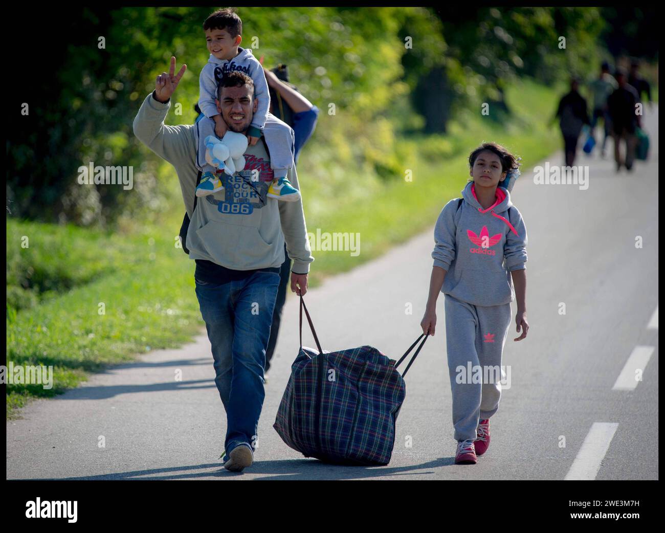 Image ©Licensed to Parsons Media. 22/09/2015.Croatia. Migrants in Croatia. Migrant children.   Croatia. Migrants walking in the village of Bapska, Croatia, after just crossing the Border from Serbia into Croatia as they make their way to Hungary.   Picture by Andrew Parsons / Parsons Media Stock Photo