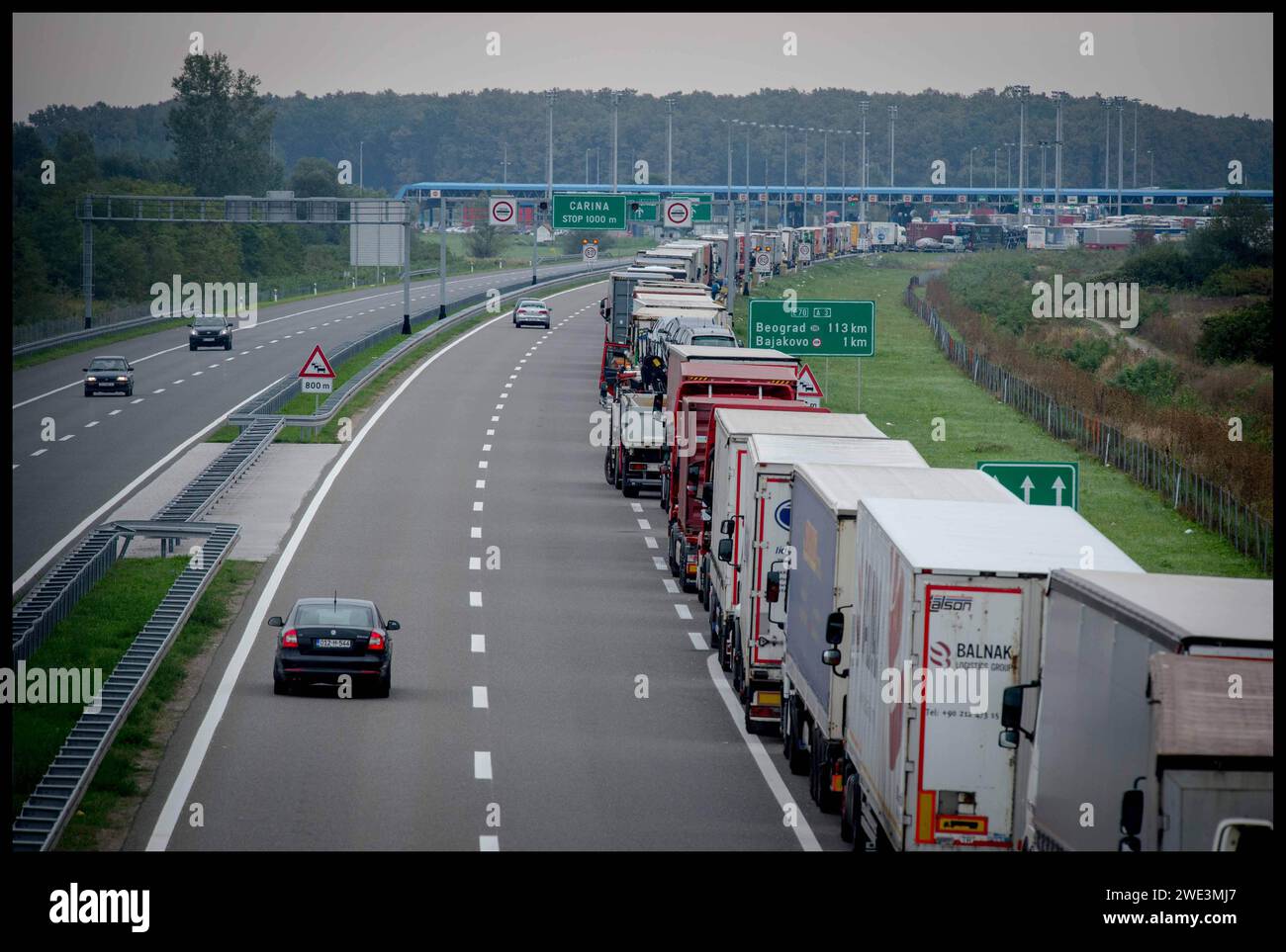 Image ©Licensed to Parsons Media. 22/09/2015.Croatia. Migrants in Croatia. Migrant children.   Croatia. Trucks queue on the side of the motorways at Tovarnik, Croatia, as they wait to cross the Serbian Border. Picture by Andrew Parsons / Parsons Media Stock Photo