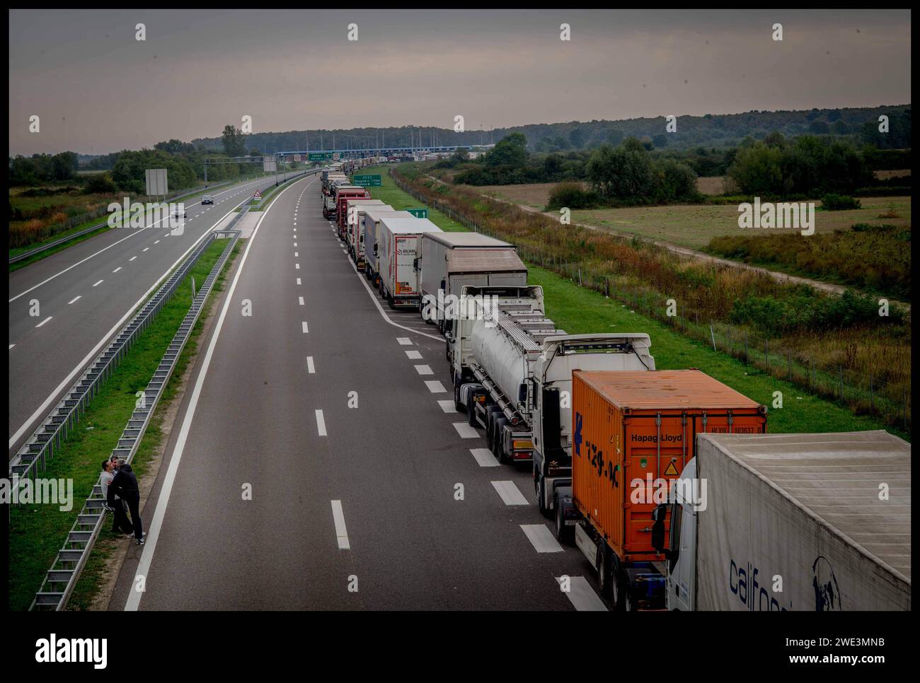 Image ©Licensed to Parsons Media. 22/09/2015.Croatia. Migrants in Croatia. Migrant children.   Croatia. Trucks queue on the side of the motorways at Tovarnik, Croatia, as they wait to cross the Serbian Border. Picture by Andrew Parsons / Parsons Media Stock Photo