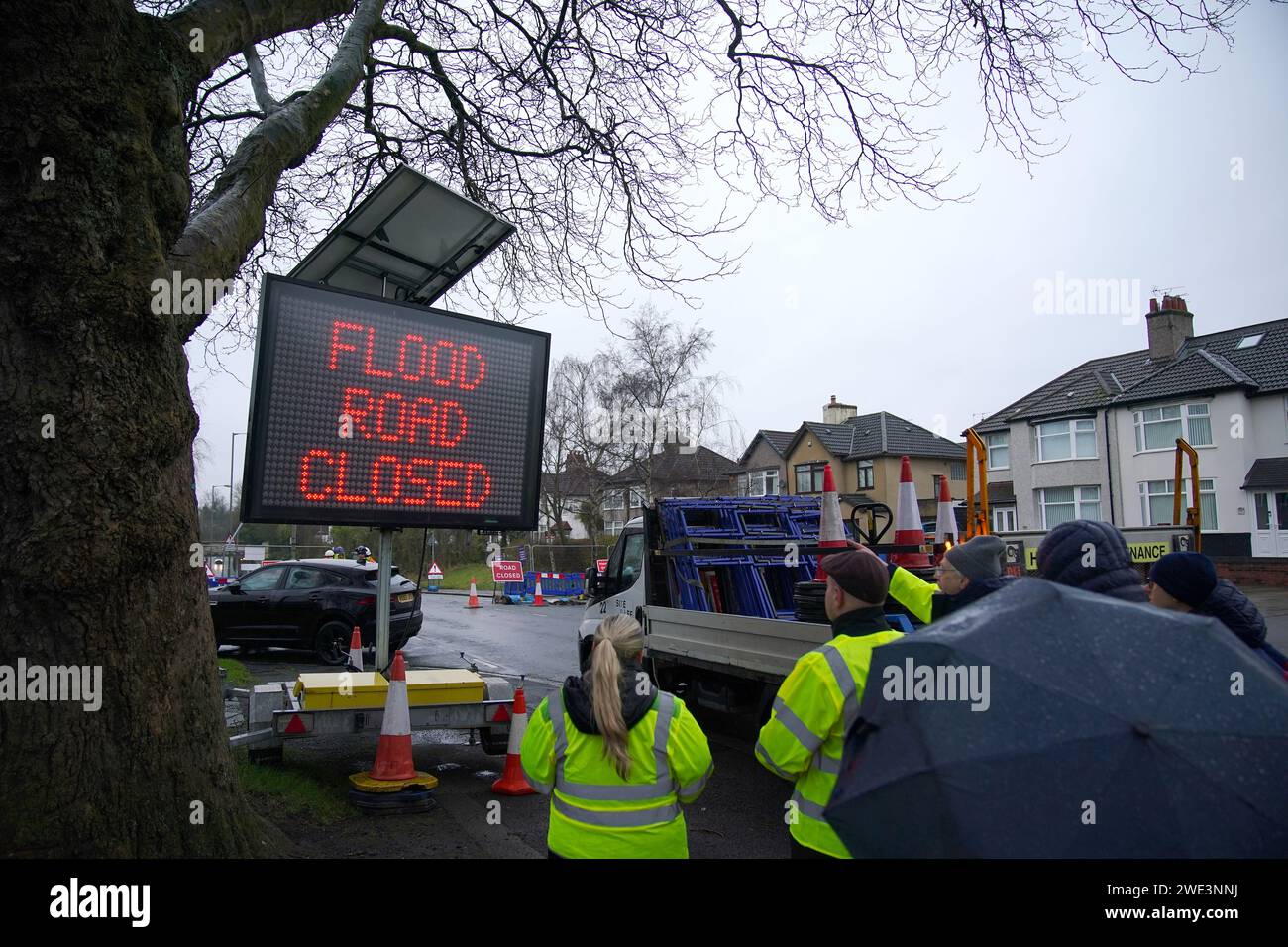 A temporary flood barrier system is put in place in Queens Drive in the