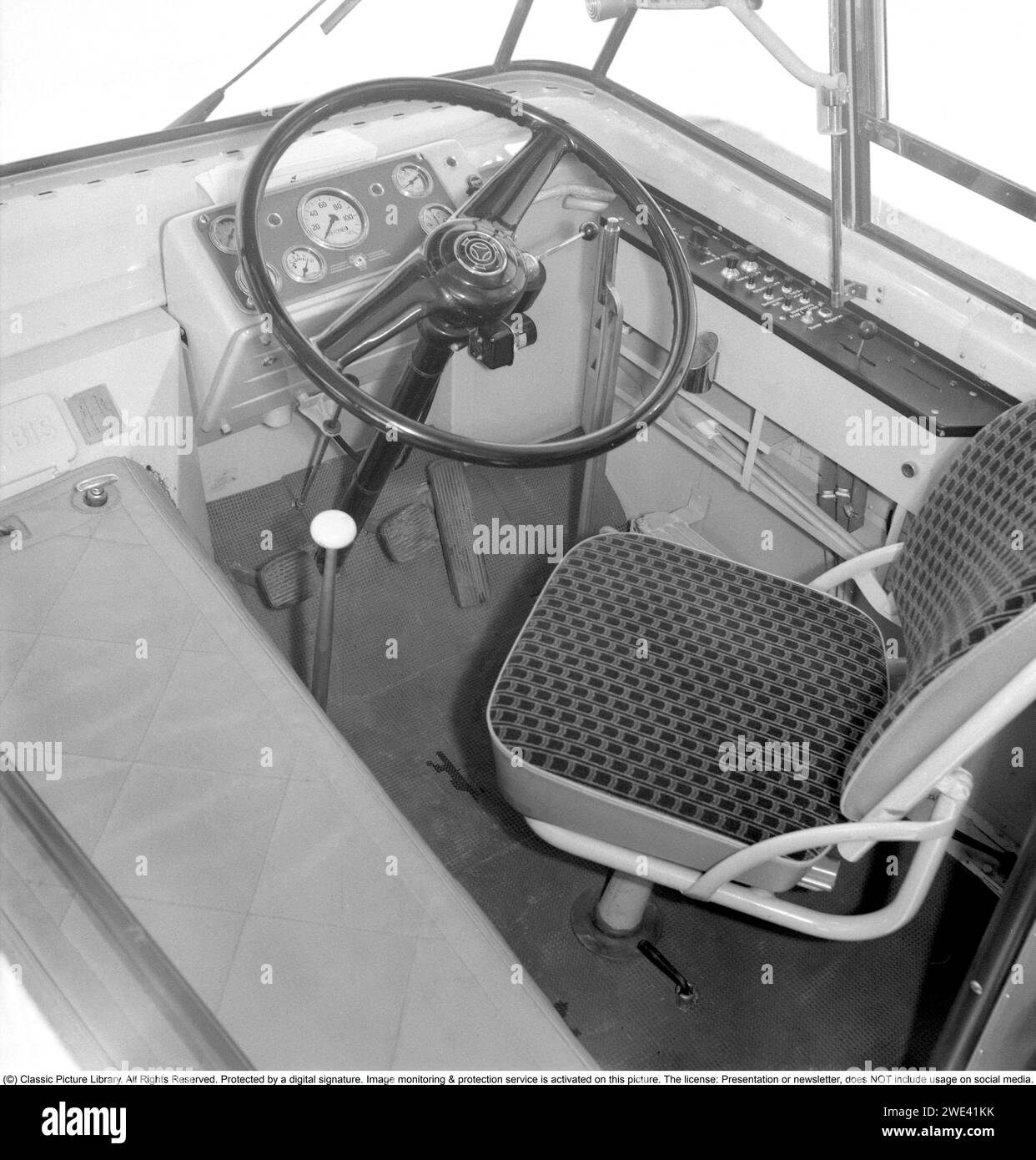 In the 1950s. Interior of a Scania Vabis bus driving seat, with the steering wheel, instrument panel and gear sticks. Sweden 1955. Kristoffersson ref BR72-11 Stock Photo