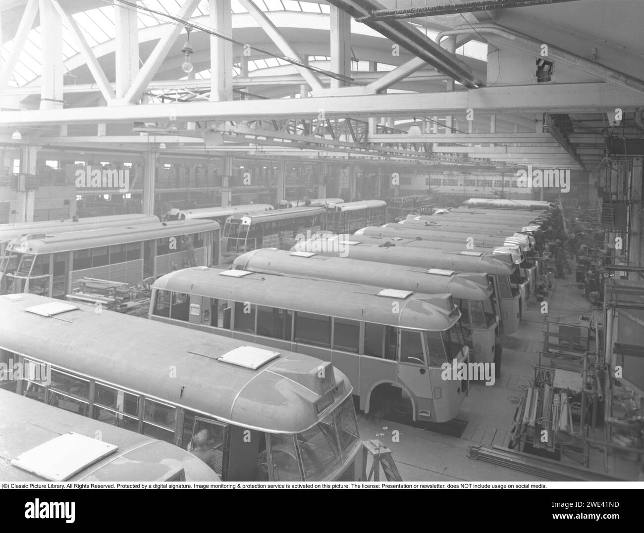 The company Hägglund and sons in Örnsköldsvik. At this time in the 1940s, the company went by the name carpentry factory. The company manufactures buses, trams, etc. The picture taken in the large assembly hall in 1949. The company is now owned by BAE Systems. Kristoffersson ref 238A-25 Stock Photo