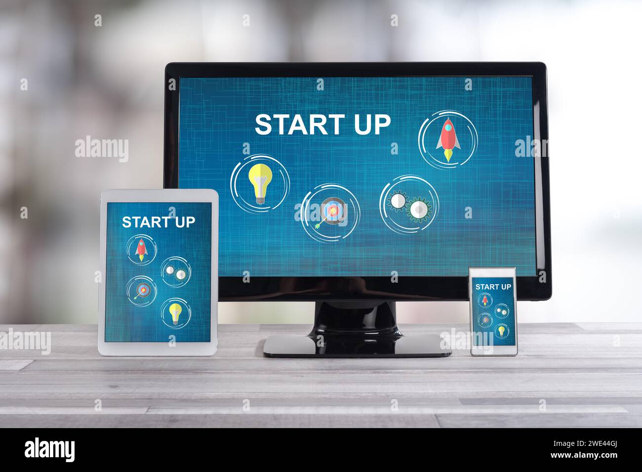 Start up concept shown on different information technology devices Stock Photo