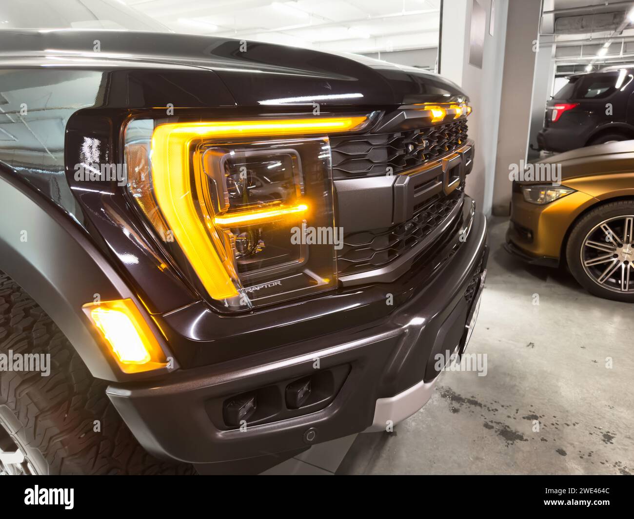 Yerevan, Armenia, August 18, 2023: Ford F-150 Raptor radiator grill and bumper with logo Ford close up. F-series ford pickup truck. Ford F-150 Raptor Stock Photo