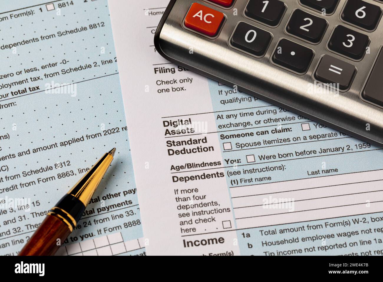 Digital assets question on 1040 federal income tax return form. Cryptocurrency, NFT and security token taxes concept Stock Photo