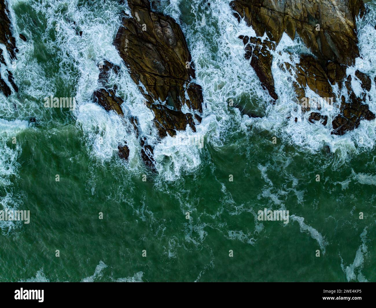 Bird eye view seashore with big wave crashing on rock cliff. Beautiful ...