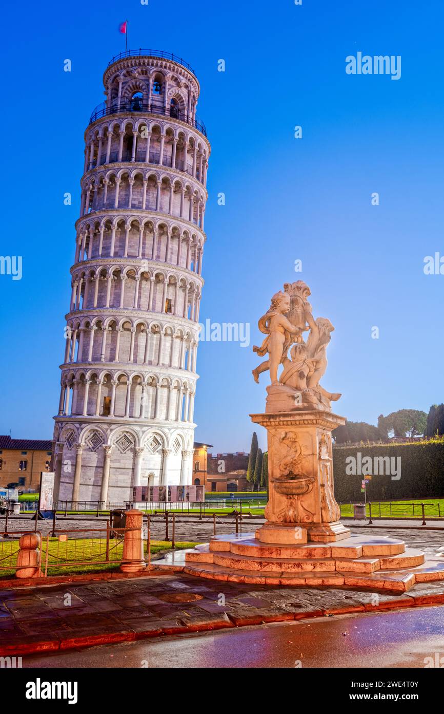 PISA, ITALY - DECEMBER 17, 2021: The Leaning Tower of Pisa in the Square of Miracles at twilight. Stock Photo