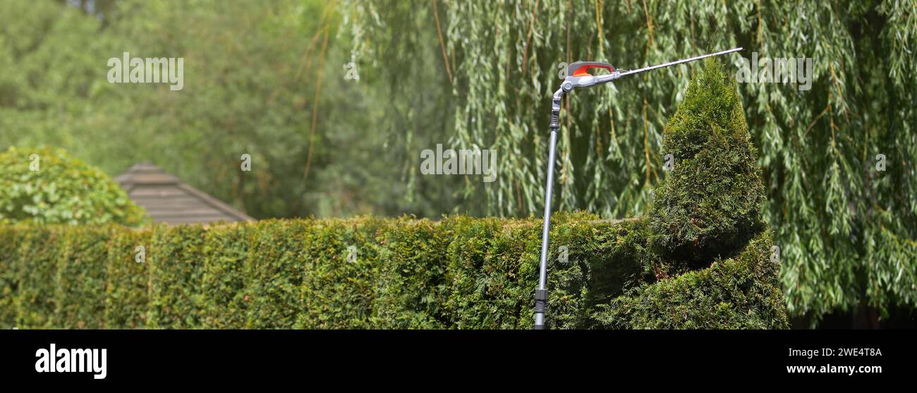 Modern extension nozzle of electric hedge trimmer, used for cutting top