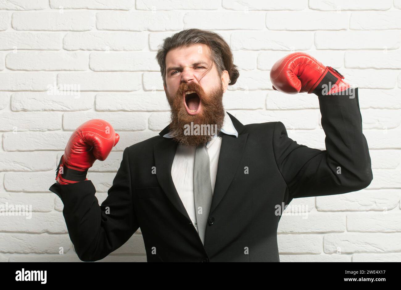 Random Man Boxing Crazy man boxing. Funny excited boxer businessman. Young man in a suit ...
