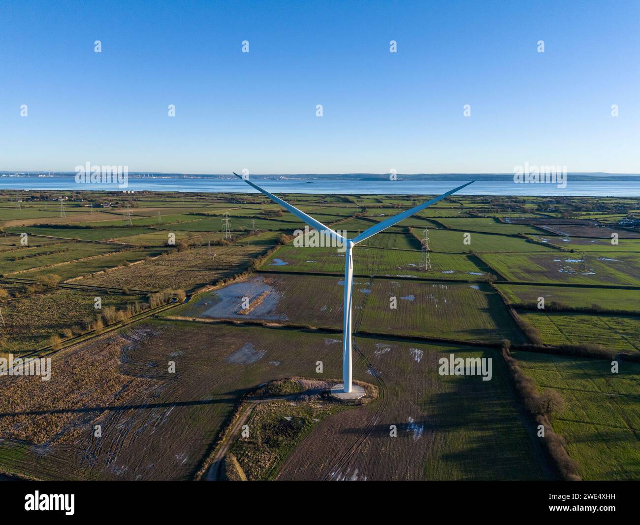 Commercial wind turbine, south Wales with the River Severn in the background. Stock Photo