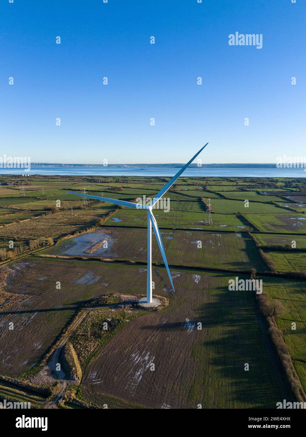 Commercial wind turbine, south Wales with the River Severn in the background. Stock Photo