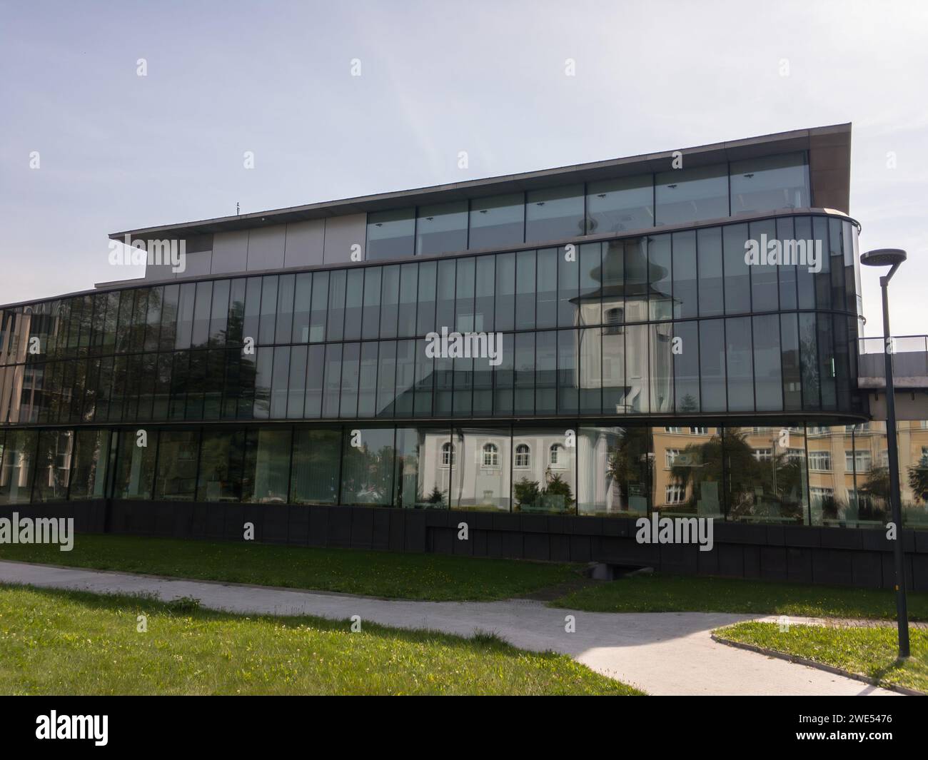 KARVINA, CZECH REPUBLIC - SEPTEMBER 13, 2020: Kostel sv. Marka church reflected in building of Ceska Sporitelna bank in Karvina Stock Photo