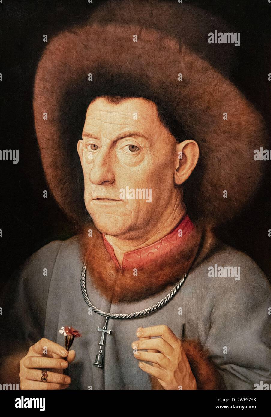 Copy after a Jan van Eyck painting; 'The Man with the Pinks' c. 1520. Portrait of a man with flowers, A later variation on a lost Van Eyck painting. Stock Photo