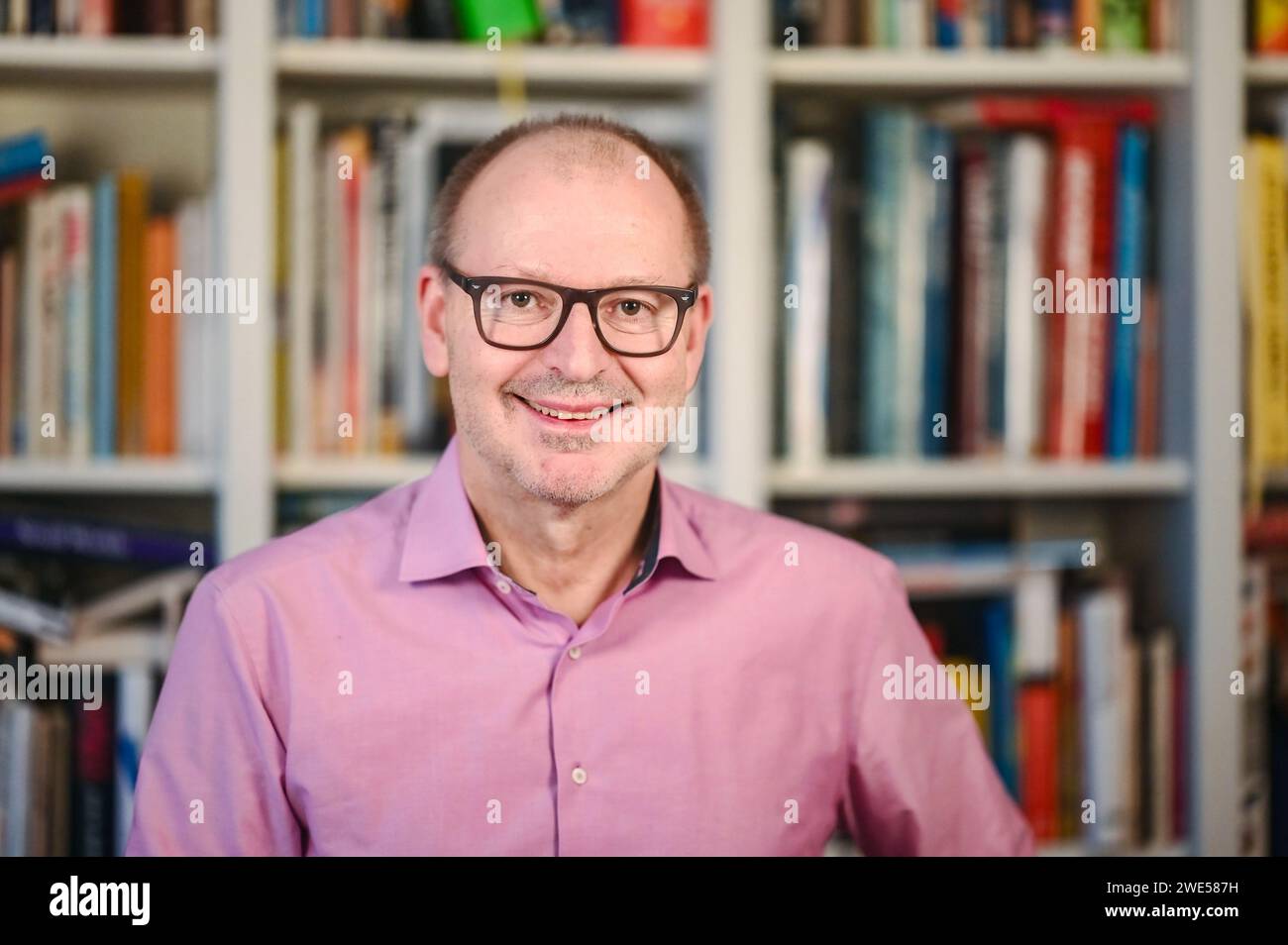 Mannheim, Germany. 23rd Jan, 2024. Christian Hesse, Professor of Mathematics at the University of Stuttgart at the Institute of Stochastics and Applications, Faculty of Mathematics and Physics, photographed in his apartment. Credit: Uli Deck/dpa/Alamy Live News Stock Photo