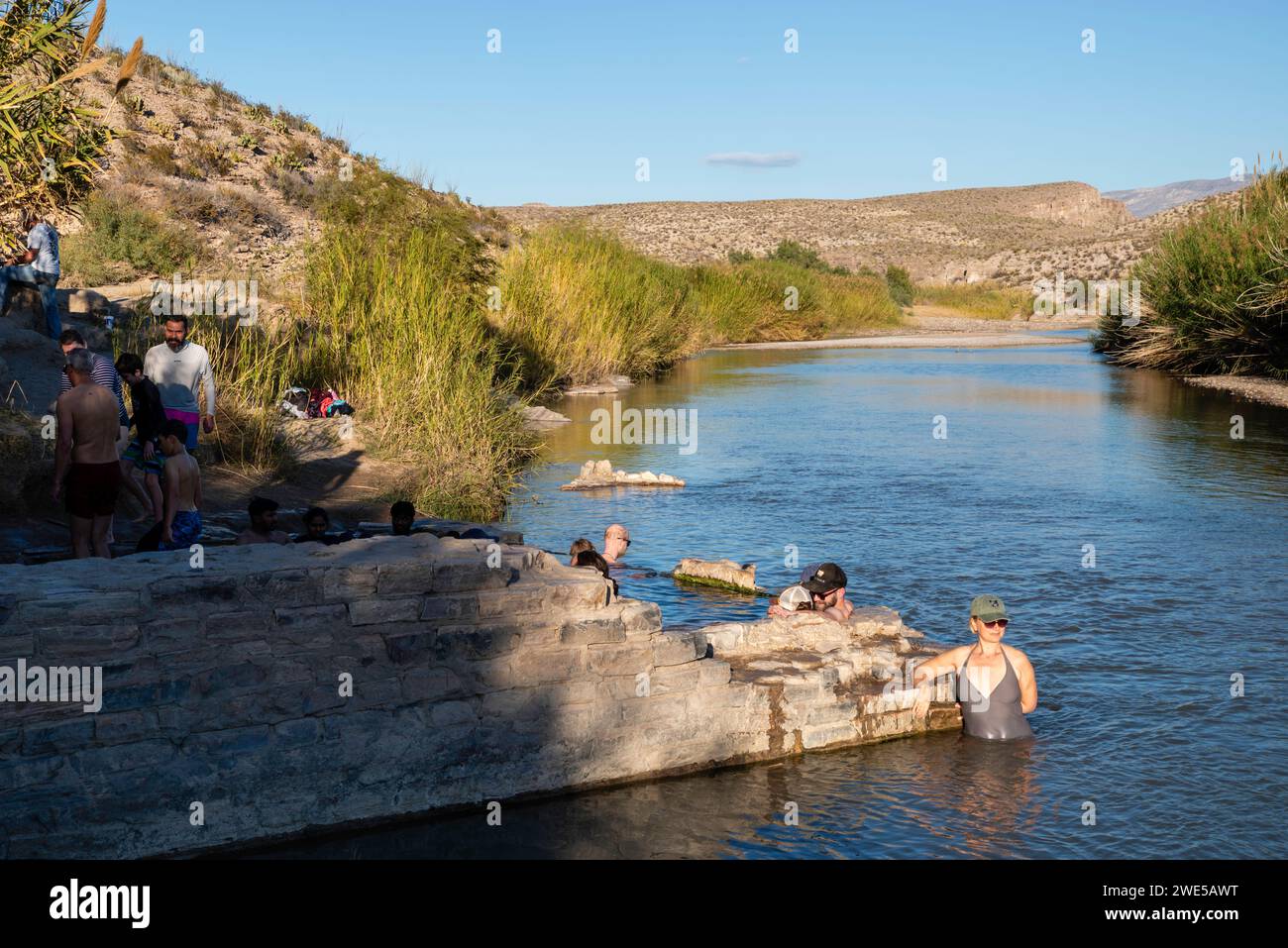 Photograph of tourists enjoying the historic Langford Hot Springs. Big