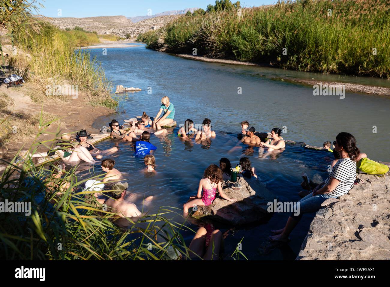 Photograph of tourists enjoying the historic Langford Hot Springs. Big