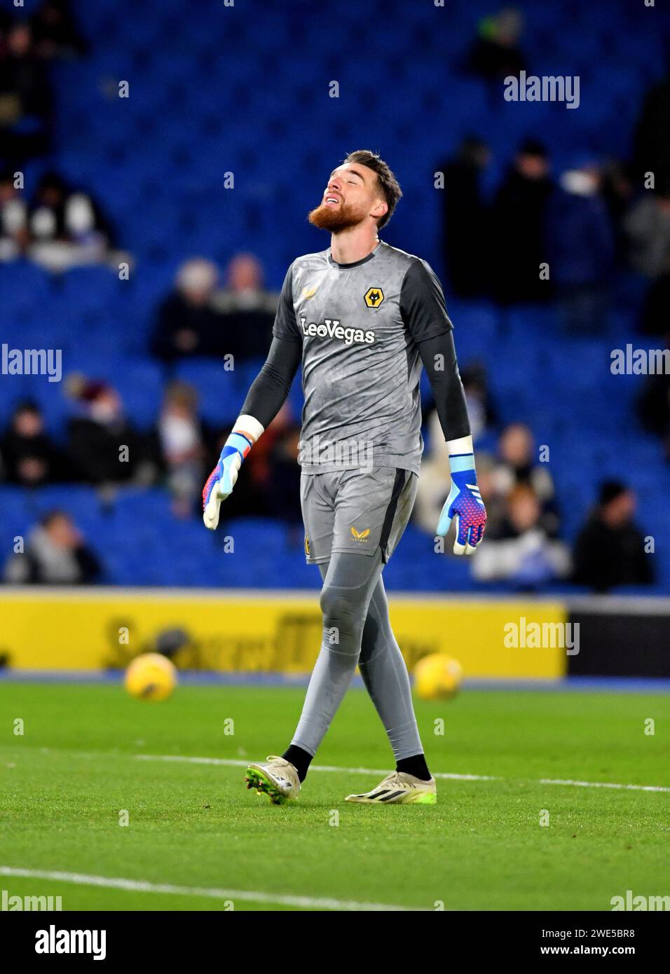 Jose Sa of Wolves warms up and looks to the skies during the Premier League match between Brighton and Hove Albion and Wolverhampton Wanderers at the American Express Stadium  , Brighton , UK - 22nd January 2024 Photo Simon Dack / Telephoto Images. Editorial use only. No merchandising. For Football images FA and Premier League restrictions apply inc. no internet/mobile usage without FAPL license - for details contact Football Dataco Stock Photo