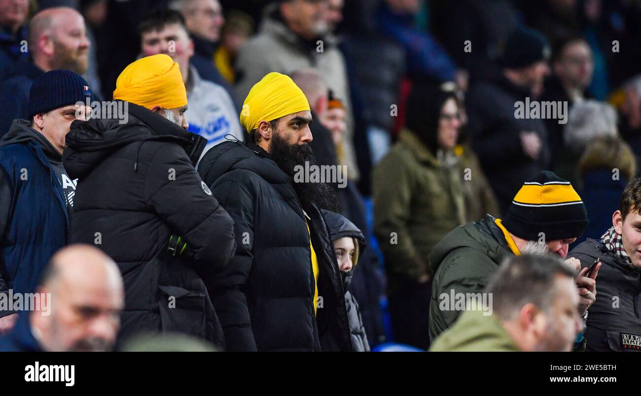 Wolves fans during the Premier League match between Brighton and Hove Albion and Wolverhampton Wanderers at the American Express Stadium  , Brighton , UK - 22nd January 2024 Photo Simon Dack / Telephoto Images. Editorial use only. No merchandising. For Football images FA and Premier League restrictions apply inc. no internet/mobile usage without FAPL license - for details contact Football Dataco Stock Photo