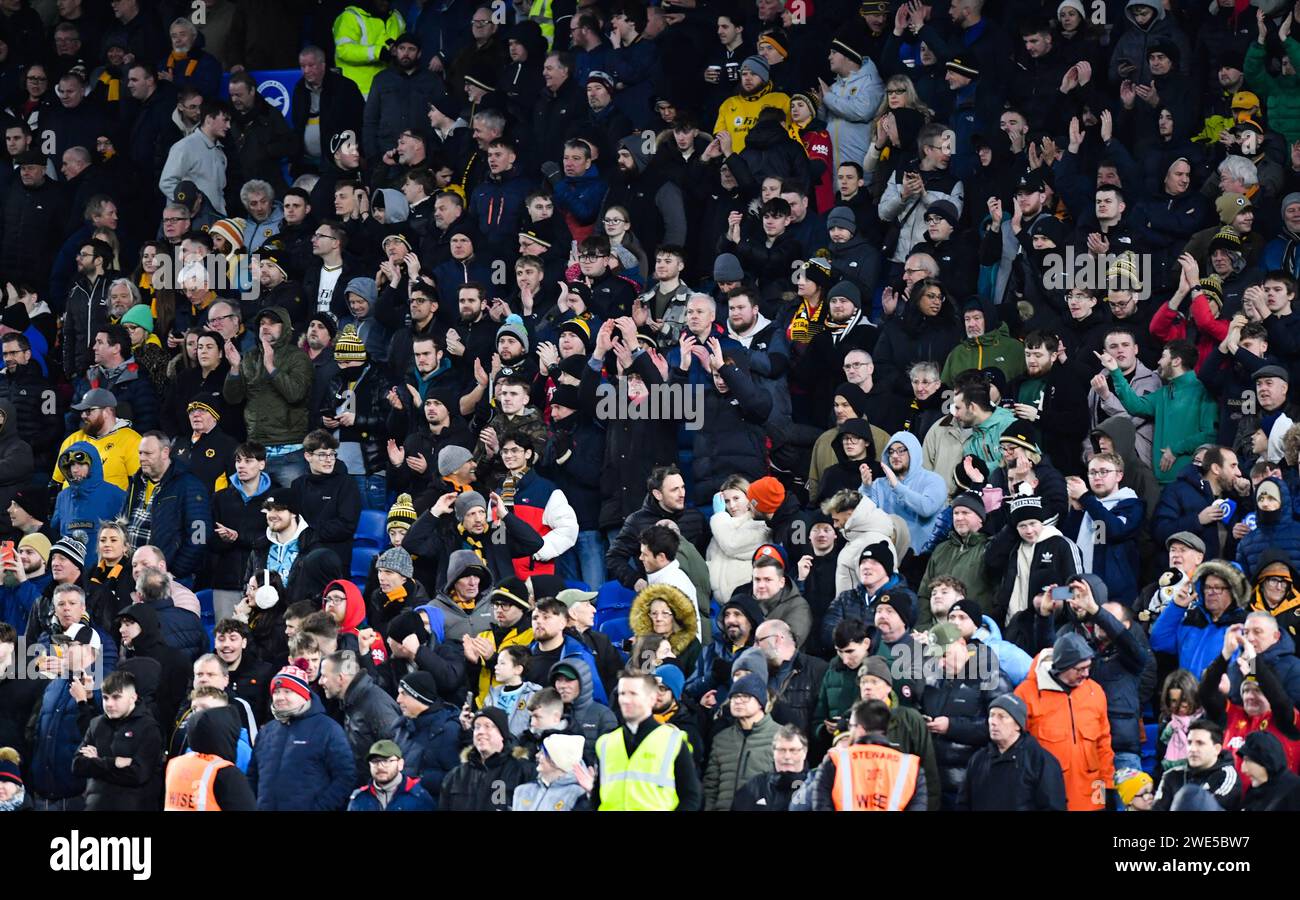 Wolves fans during the Premier League match between Brighton and Hove Albion and Wolverhampton Wanderers at the American Express Stadium  , Brighton , UK - 22nd January 2024 Photo Simon Dack / Telephoto Images. Editorial use only. No merchandising. For Football images FA and Premier League restrictions apply inc. no internet/mobile usage without FAPL license - for details contact Football Dataco Stock Photo