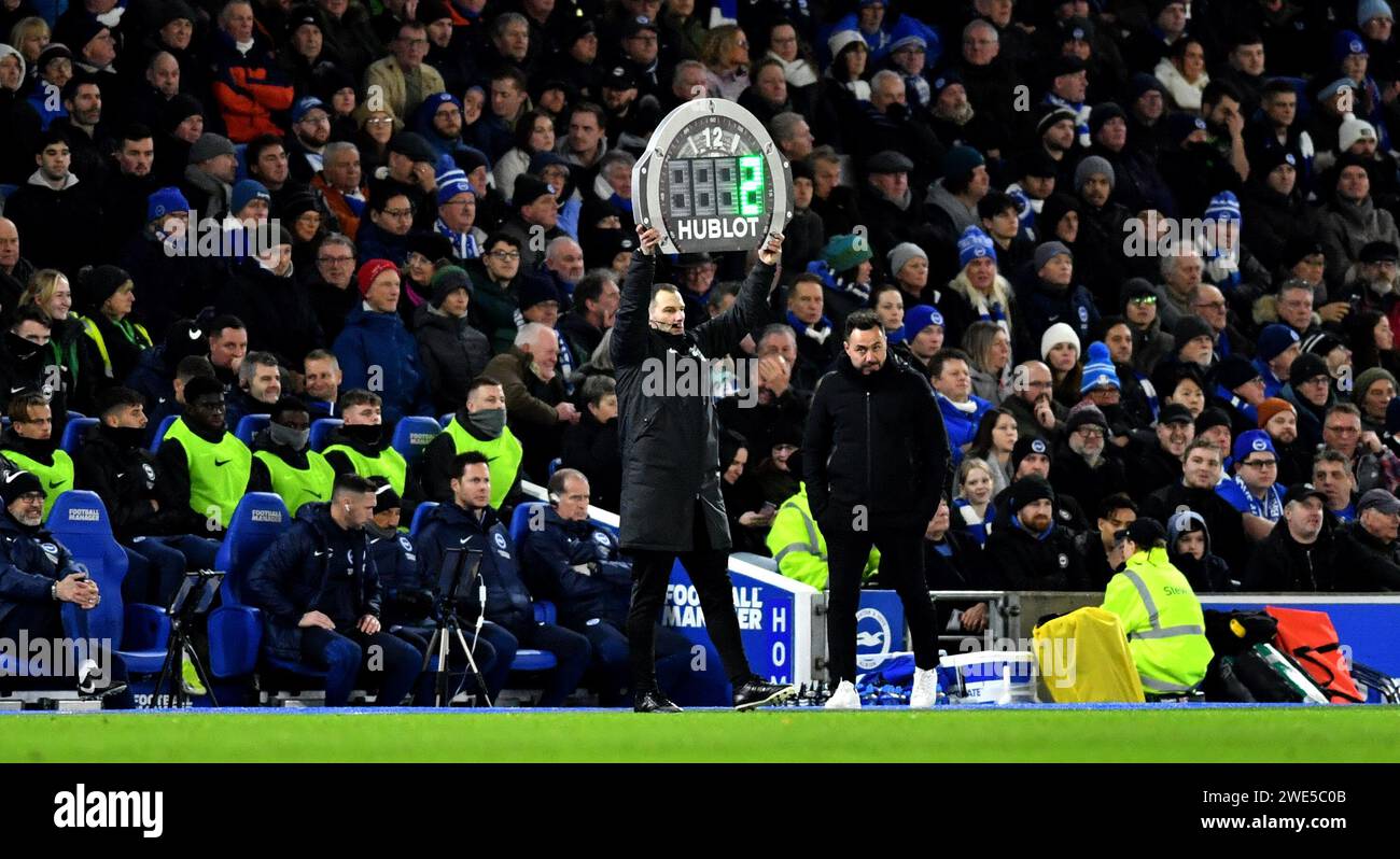 Fourth official holds up the added minutes sign at en d of first half during the Premier League match between Brighton and Hove Albion and Wolverhampton Wanderers at the American Express Stadium  , Brighton , UK - 22nd January 2024 Photo Simon Dack / Telephoto Images. Editorial use only. No merchandising. For Football images FA and Premier League restrictions apply inc. no internet/mobile usage without FAPL license - for details contact Football Dataco Stock Photo