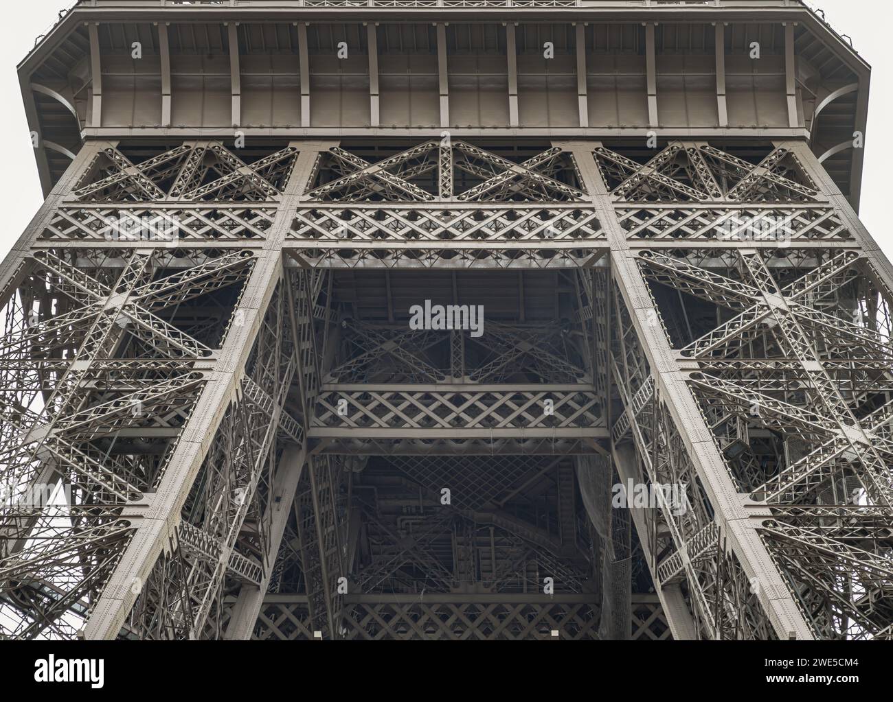 France, Paris - Jan 4, 2024 - Architectural detail design of the famous Eiffel Tower iron structure. Close-up of the framework of the Eiffel Tower in Stock Photo